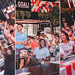 Three side-by-side images of a lively indoor bar or fan zone where groups of people sit at long tables with drinks, watching a sports event on screens. The crowd reacts animatedly, with several individuals raising hands or leaning forward. Large signage includes the word “GOAL!”, and some attendees wear sports jerseys and hold flags, suggesting a football match atmosphere under bright, neon-style lighting.