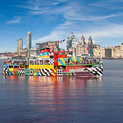 A Mersey Ferry boat sailing across the Mersey river.
