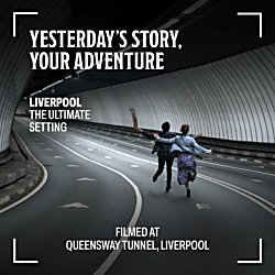 Two people running up a tunnel on the road.