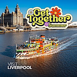 An image of Mersey Ferry sailing along the Mersey River with the Royal Liver Building in the background.