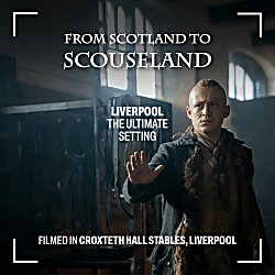 A character from Outlander standing in Croxteth Hall stables.