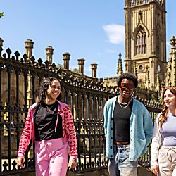 People outside bombed out church in the day time
