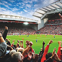 People wathing a football match at Anfield