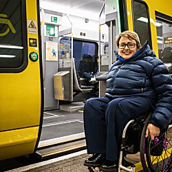 Tanni Grey-Thompson outside Meseyrail 777 train