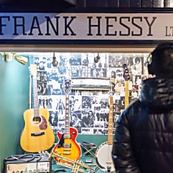 The Beatles Story exhibition with writing saying 'Frank Hessy' above the door.