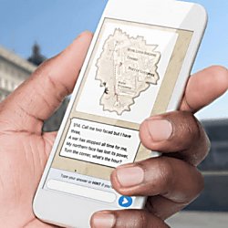 A hand holding a phone with the Treasure Hunt Liverpool page.