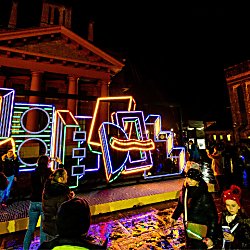 A geometric shape of boxes and neon lights outside the historic Martin Luther King Jr building at night