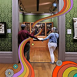 Two people holding hands walking through to another room in a museum.