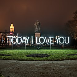A light art installation that says Today I Love You in a park.