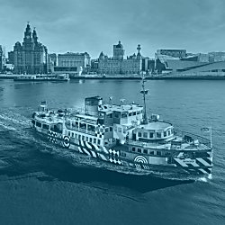An image of the Mersey Ferry sailing along the Mersey with the skyline of Liverpool showing in the distance.