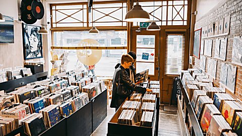 A record store with two people looking through records.