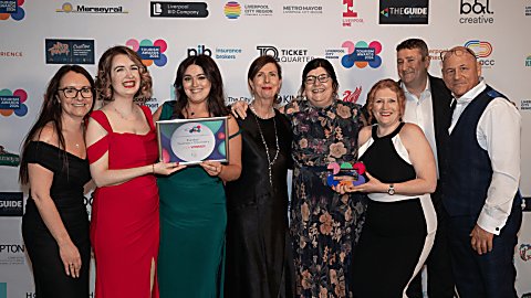 People standing holding an award at the LCR Tourism Awards
