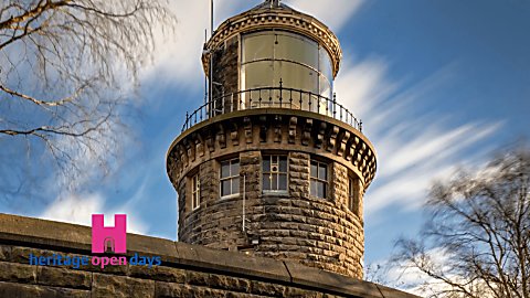 Bidston Lighthouse, a brick tower in a blue cloudy sky