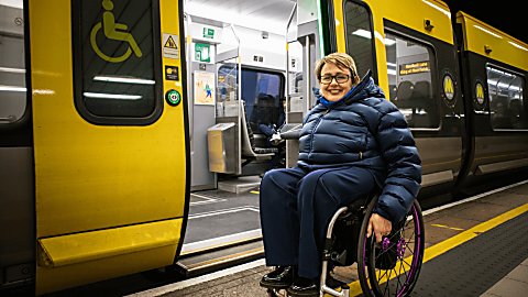 Tanni Grey-Thompson outside Meseyrail 777 train