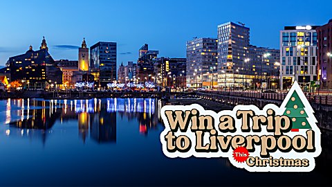 A waterfront photo in the night time with buildings lit up and a logo that says Win a trip to Liverpool this Christmas.