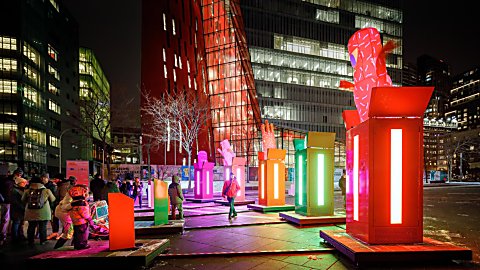 Large boxes that light up with characters popping out of the top of them.