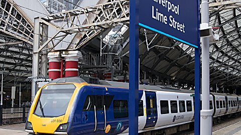 An image of Northern Train with a blue sign saying ''Liverpool Lime Street''.
