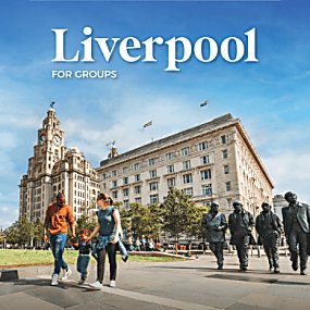 Image of Royal Liver Building and the Cunard building with The Beatles statue in front of them. To the left of the image is a family walking along the Pier Head.