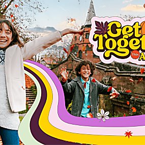 Two kids looking at the camera and smiling brightly with autumn leaves falling around them. The text says 'Get Together This Autumn'.