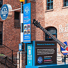 Outside of the Beatles Story with the sign at the entrance.
