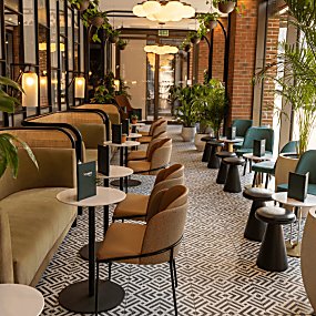 Inside the Halyard hotel with tables and chairs in a restaurant space