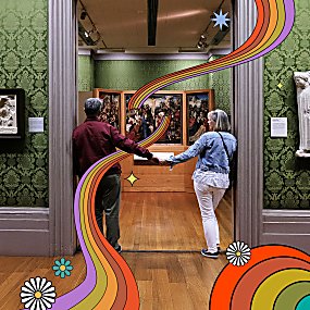 Two people holding hands walking through to another room in a museum.