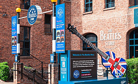 Outside of the Beatles Story with the sign at the entrance.