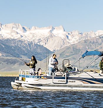 Pontoon boat on the Bridgeport Reservoir with a group fishing.