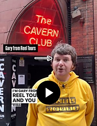 A person wearing a yellow jumper stood outside The Cavern Club.