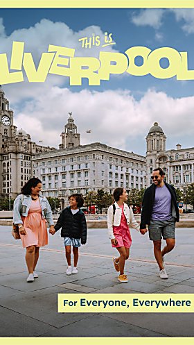 A family of four with two adults and two children walking across Pier Head in Liverpool. It says Liverpool in yellow letters.