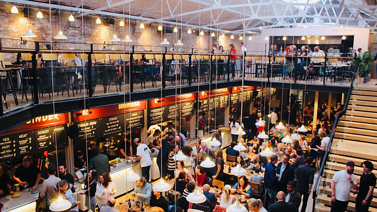 People chatting and eating in Duke Street Food and Drink Market
