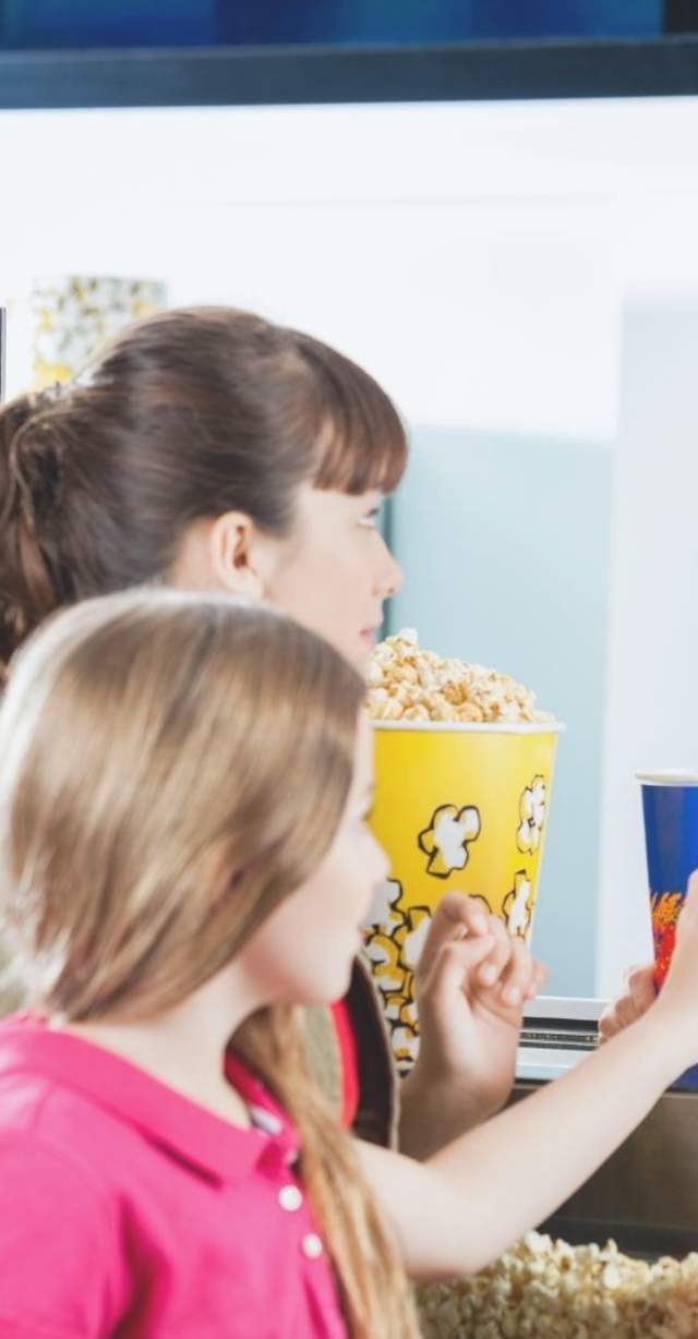 Concessions Attendant handing soda to guest