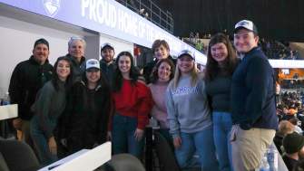 Group of guests enjoying a DCU Center in a suite