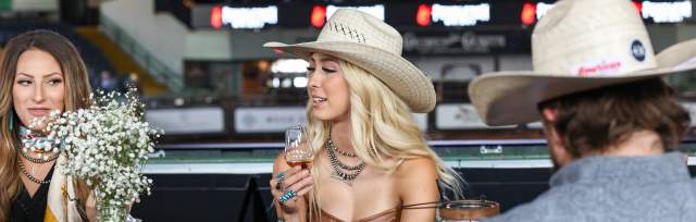 Image of a woman enjoying a drink on the Platinum Deck