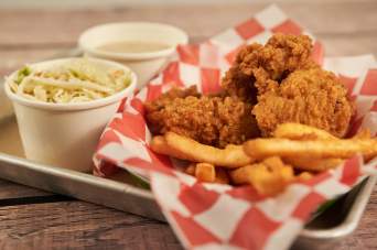 Indulge in crispy perfection with our succulent chicken tenders, a timeless favorite for all ages