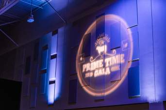 Monogram lighting wash on event wall with uplighting accents