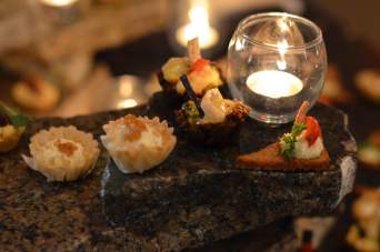 Close up of appetizer cups and tealight candle
