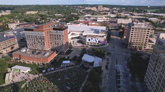 Drone shot of the DCC centered in downtown taken from over the Levitt Pavilion with a long view of Dayton