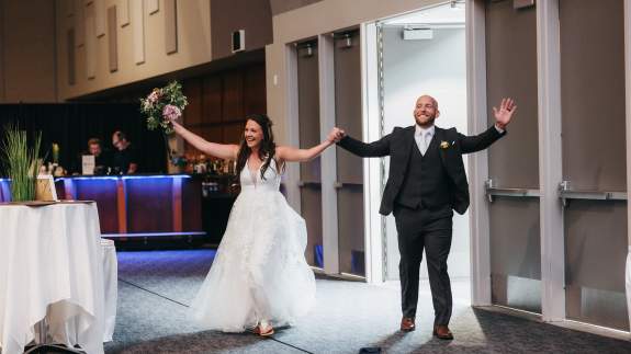 Married Couple Entering into Their Reception