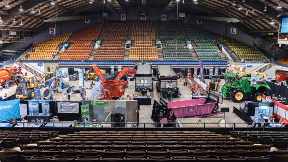 Overhead view of farm equipment placed in the arena for a farm expo