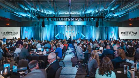 Crowd and Front of Stage Setup for a Large Conference Presentation