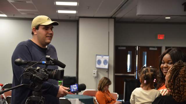 News station doing an interview with patrons