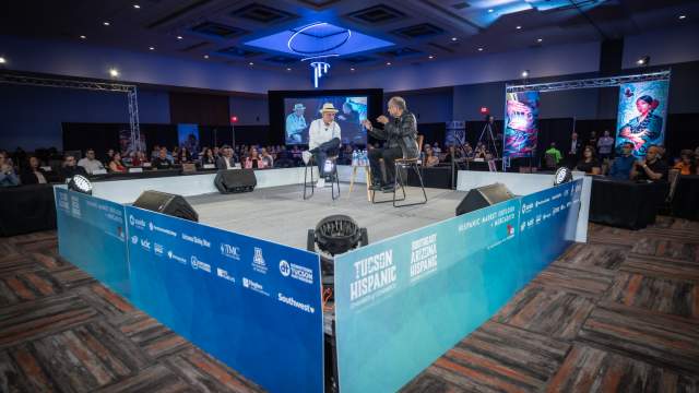 image of a conversation happening at a conference inside the Tucson Convention Center