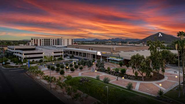 Image of the Tucson Arena with A Mountain in the background