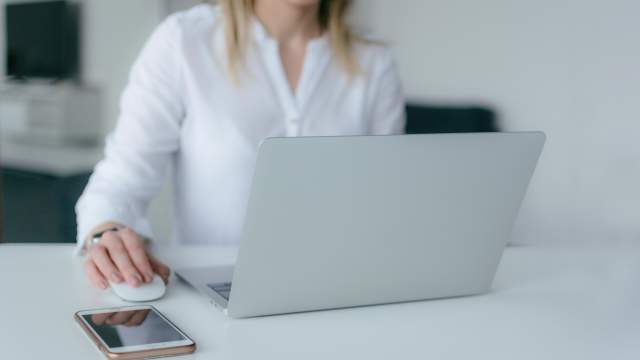 image of a woman working on a laptop