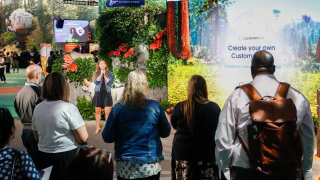 A group of people at a convention center exhibit