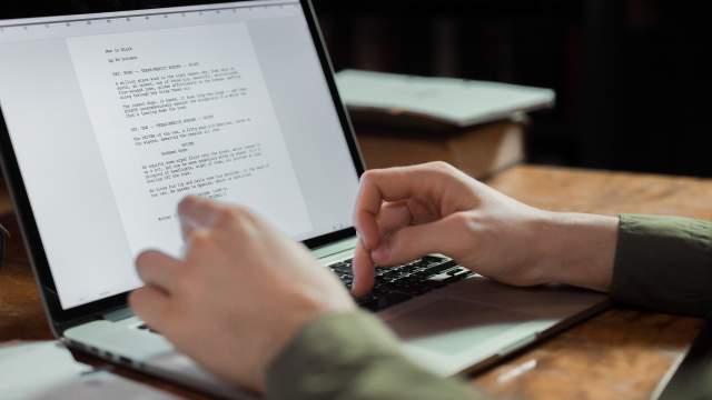 Guest typing on a laptop computer