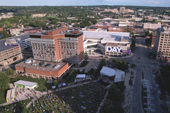 Drone shot of the DCC centered in downtown taken from over the Levitt Pavilion with a long view of Dayton