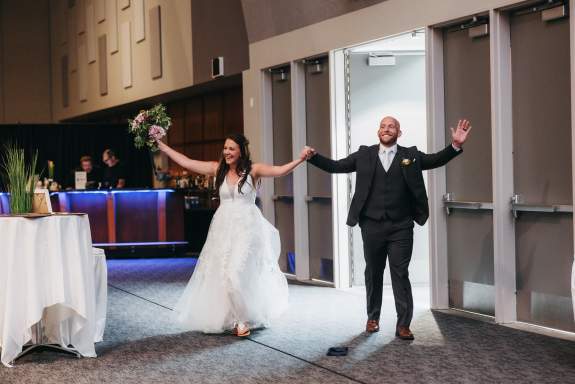 Married Couple Entering into Their Reception