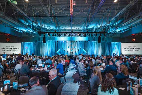 Crowd and Front of Stage Setup for a Large Conference Presentation